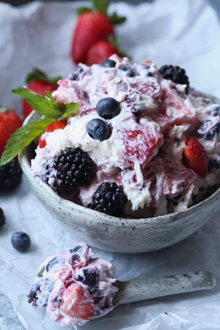 Berry Ambrosia Salad served in a white bowl.