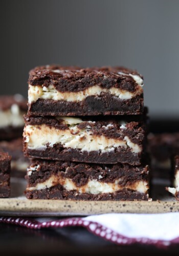 A Close-up of Three Cheesecake Stuffed Brownies From the Side