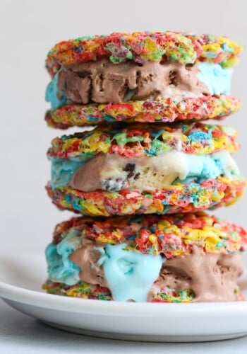 A stack of Fruity Pebble Ice Cream Sandwiches on a plate