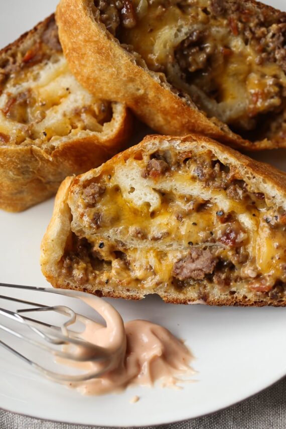 GARBAGE BREAD!! This is a simple recipe that can be adapted SO many ways! Bacon Cheeseburger Garbage Bread is our favorite, but throw your leftovers in a pizza crust and roll it up! The possibilities are endless.