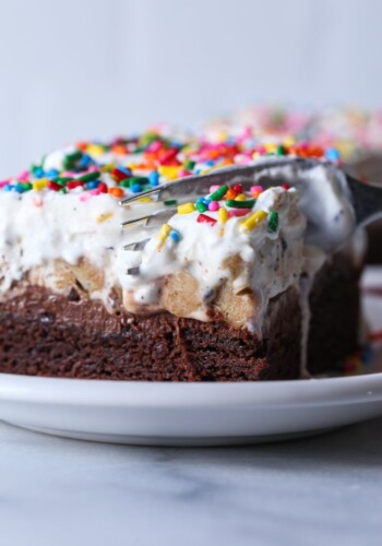 Brownie Bottom Ice Cream Cake is the best ice cream cake made with fudgy brownies, chocolate frosting, and cookie dough ice cream!