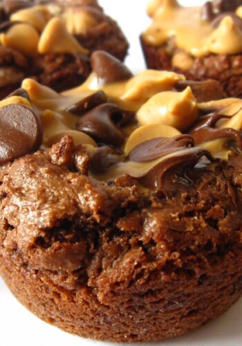 Close-up of individual brownie cups topped with peanut butter and chocolate