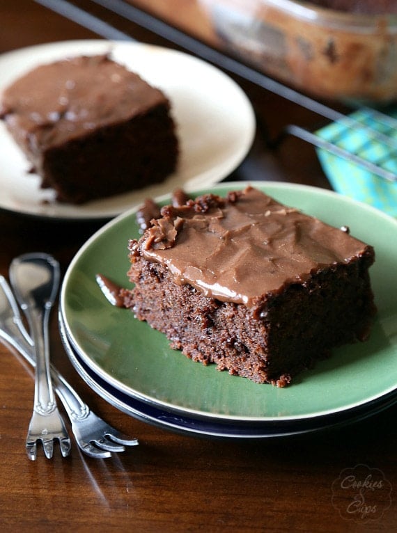 Chocolate Zucchini Cake. A dense rich chocolate cake with a poured frosting that melts right in to the cake!