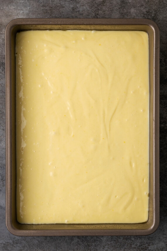 Sour cream cake batter in rectangular baking pan.