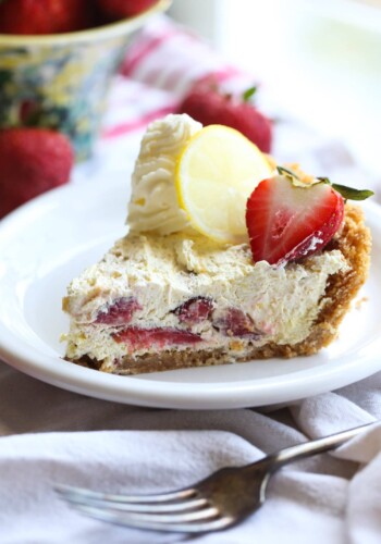 Slice of No Bake Strawberry Lemon Icebox Pie on a plate.