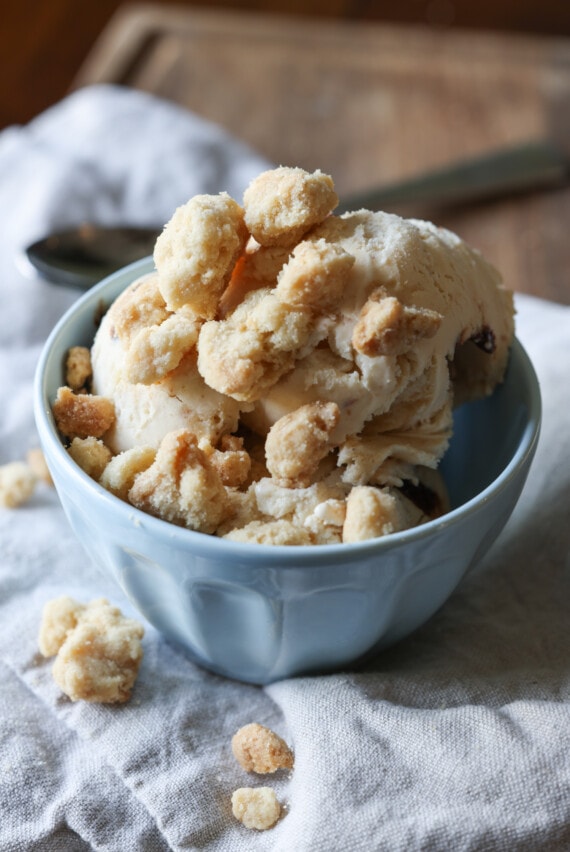A bowl of ice cream topped with streusel topping
